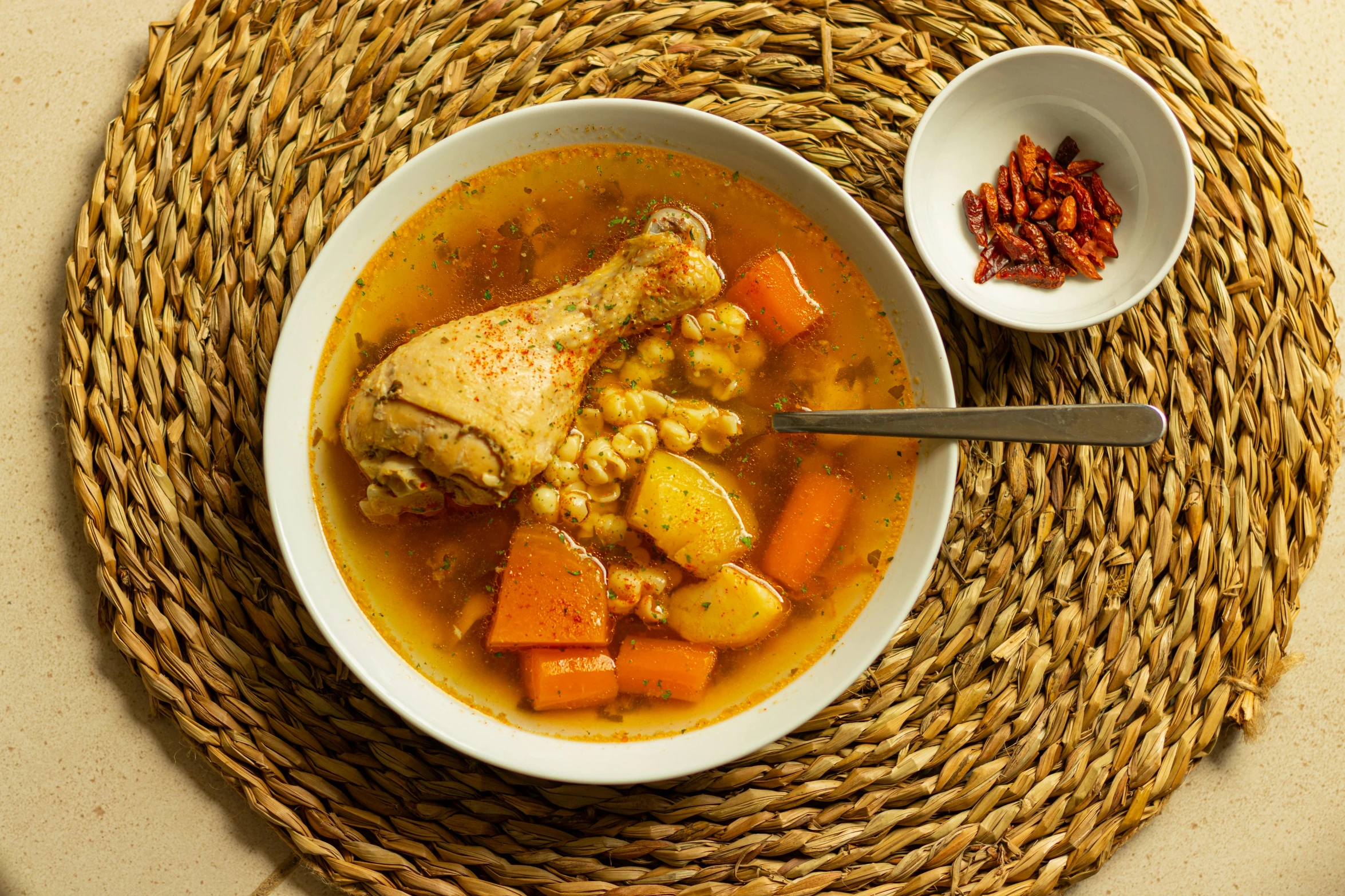 a bowl of soup sitting on top of a table, inspired by Géza Dósa, chicken, thumbnail, romanian, chile