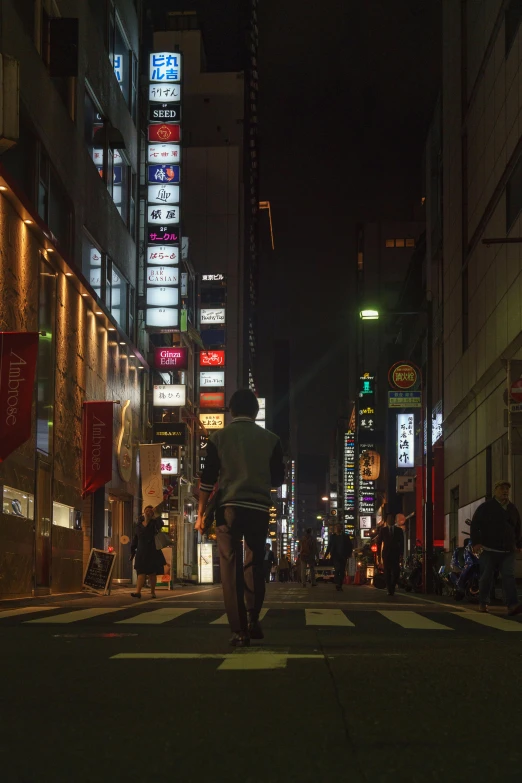 a person riding a bike down a city street at night, inspired by Kanō Naizen, unsplash contest winner, street signs, people walking down a street, arasaka, man walking through city