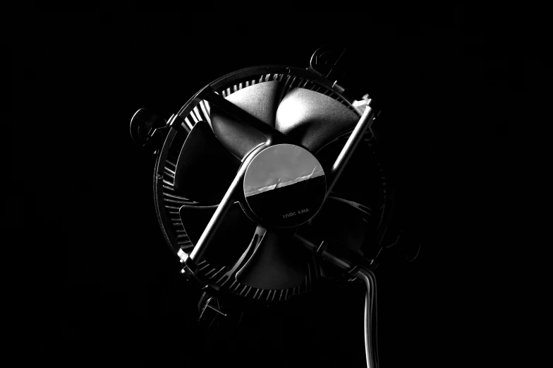 a black and white photo of a fan in the dark, an album cover, by Karl Buesgen, pexels contest winner, conceptual art, miniature product photo, aaaaaaaaaaaaaaaaaaaaaa, computer generated, symmetrical rim light