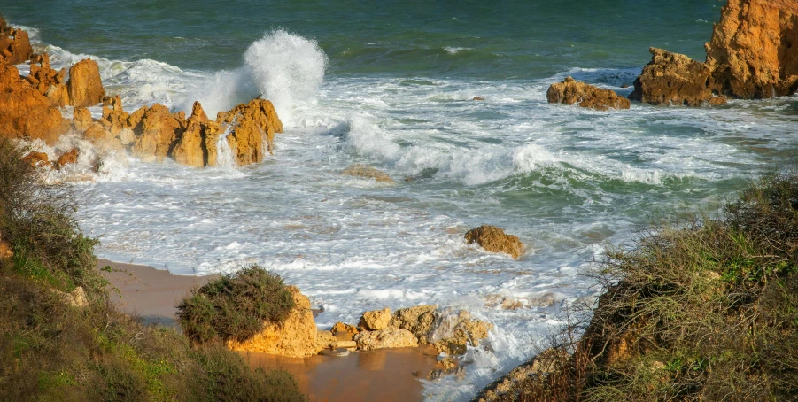 a body of water that is next to some rocks, inspired by Joaquín Sorolla, pexels contest winner, waves crashing, manuka, omaha beach, today\'s featured photograph 4k