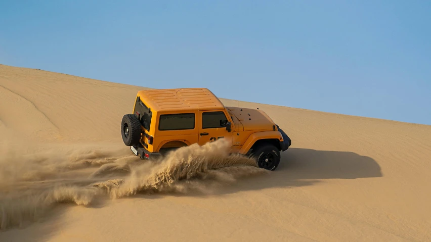 a yellow jeep driving on top of a sand dune, underbody, detailing, square, arabian