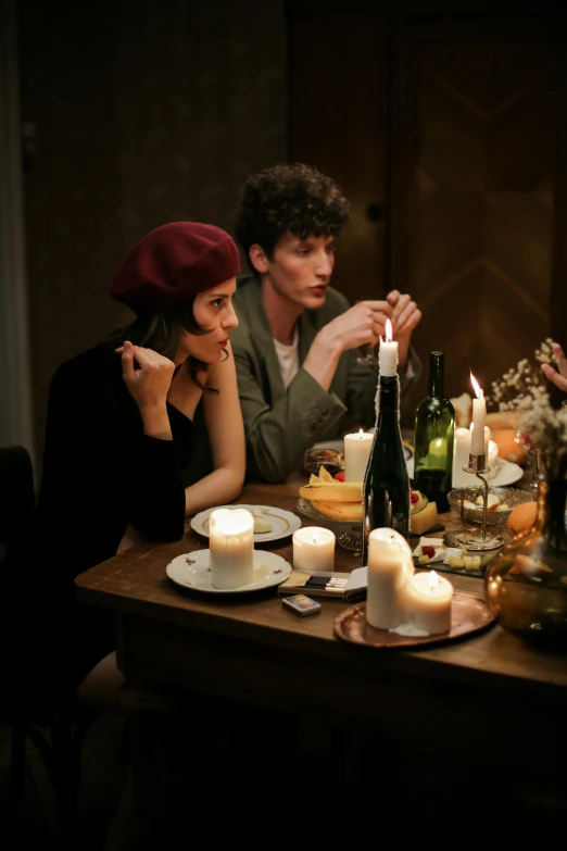 a group of people sitting around a dinner table, inspired by Nan Goldin, renaissance, wearing a french beret, natural candle lighting, couple, lifestyle