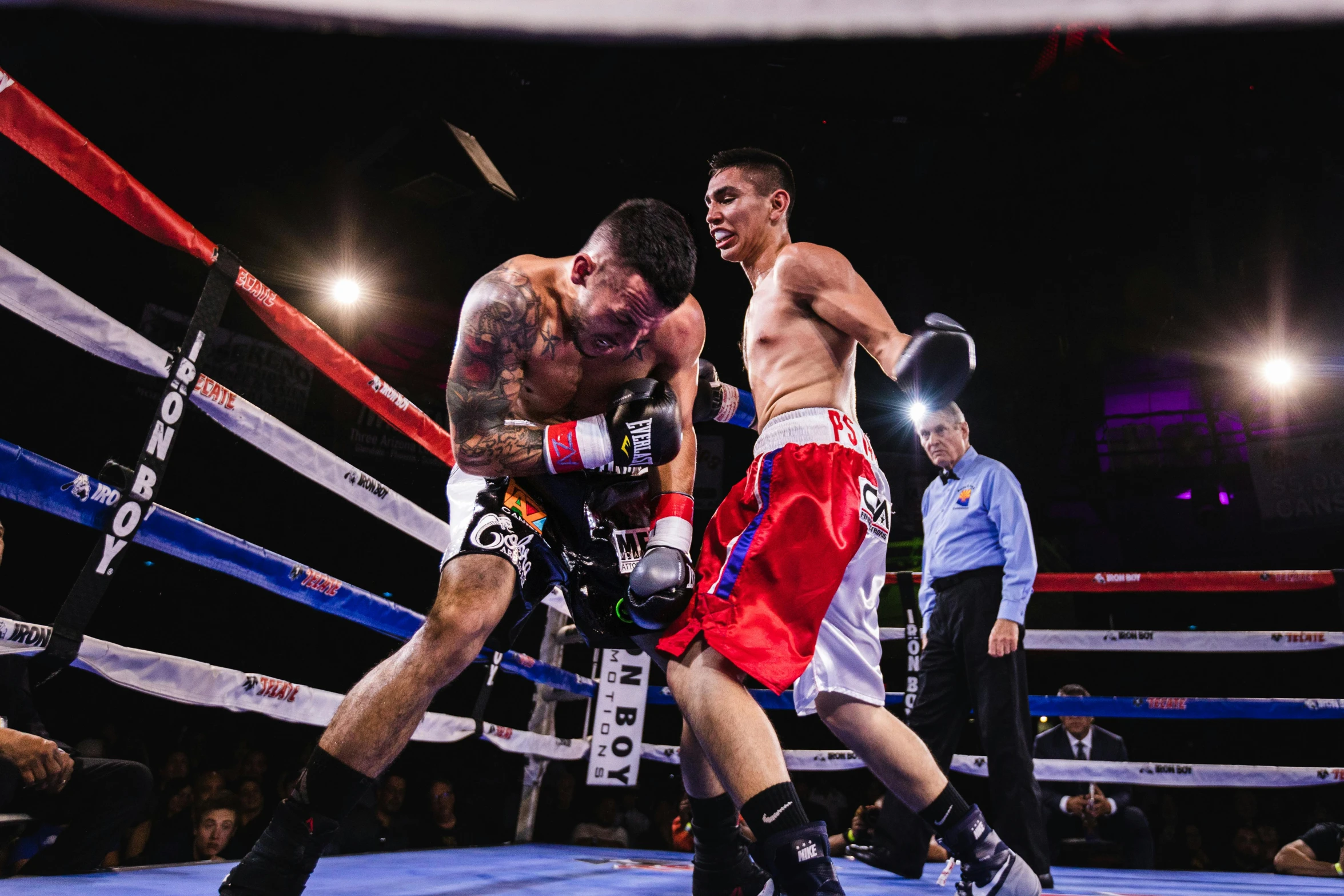 a couple of men standing next to each other in a boxing ring, by Robbie Trevino, pexels contest winner, happening, mid action, 2 5 6 x 2 5 6 pixels, photo finish, juan diaz canales