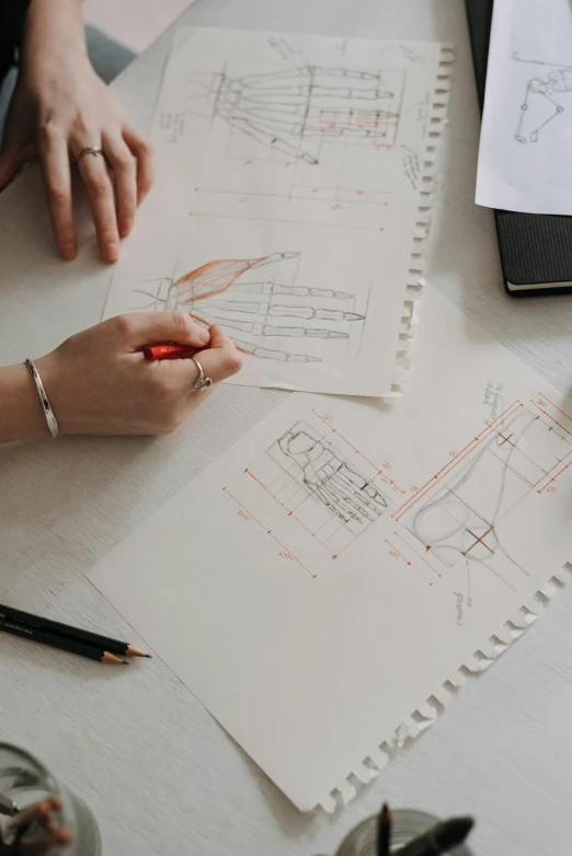 a couple of people that are sitting at a table, a drawing, trending on pexels, detailed technical drawing, over-shoulder shot, high quality photo, design only