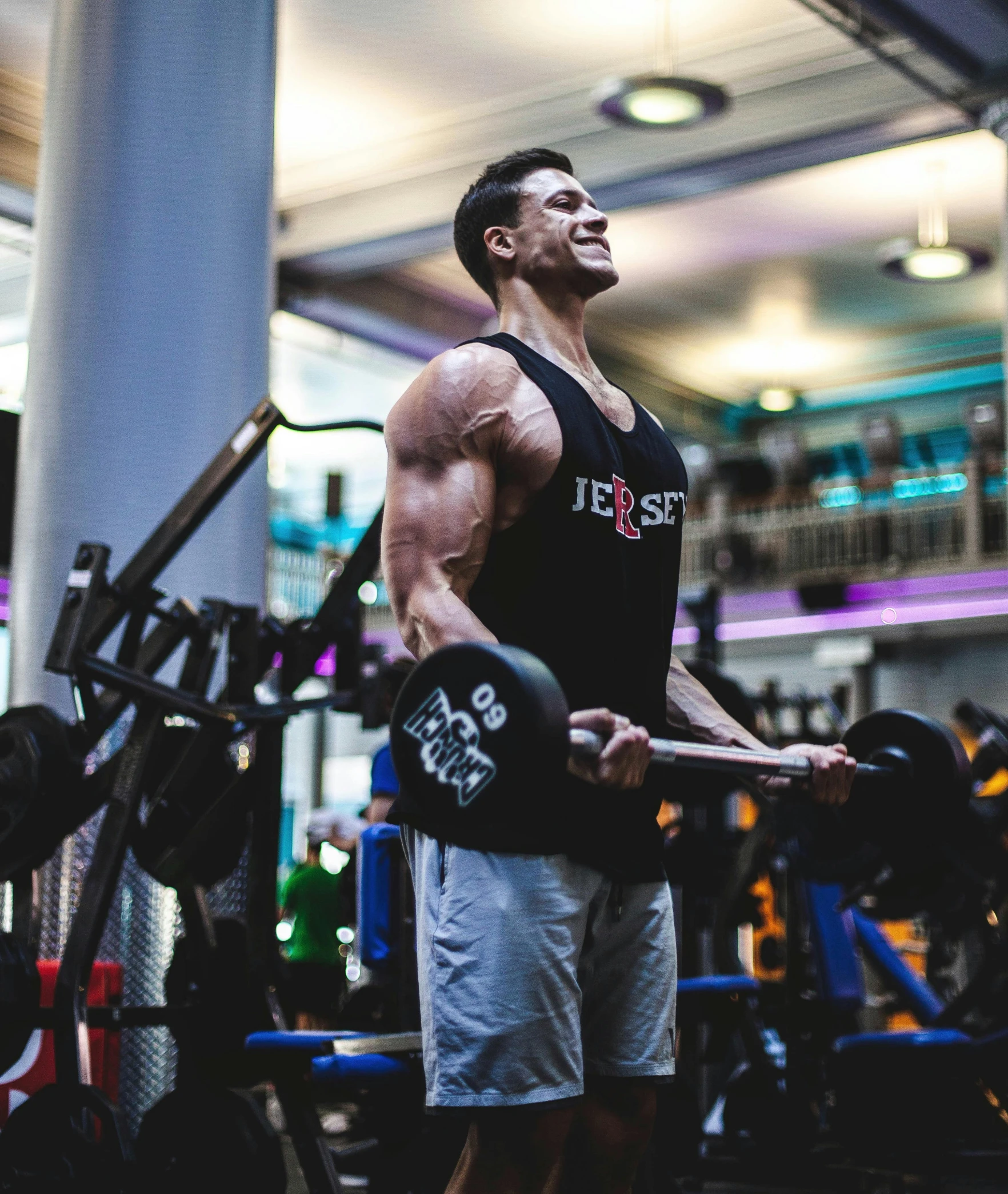 a man holding a barbell in a gym, by Adam Marczyński, ernest khalimov body, taking control while smiling, profile image, 🦑 design