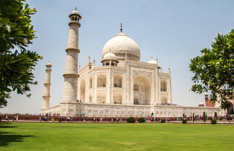 a large white building sitting on top of a lush green field, a marble sculpture, pexels contest winner, taj mahal made of cheese, square, thumbnail, brown