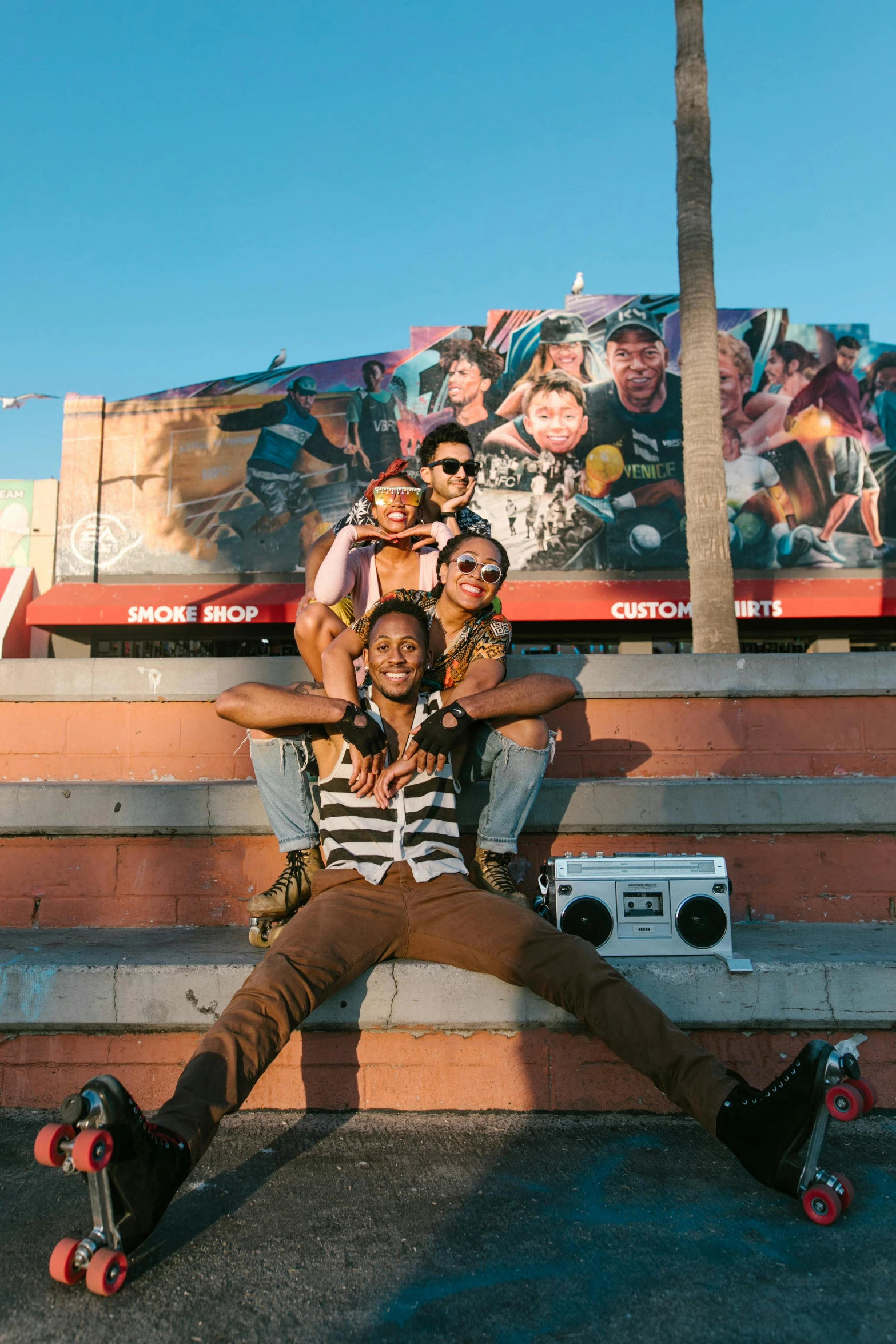 a couple of people that are sitting on some steps, a picture, trending on pexels, black arts movement, photograph of three ravers, hollywood promotional image, lomography photo, billboard image