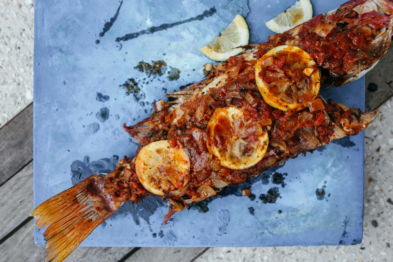 a close up of a fish on a cutting board, by Emma Andijewska, pexels contest winner, hurufiyya, smoked layered, greek, thumbnail, 🦩🪐🐞👩🏻🦳