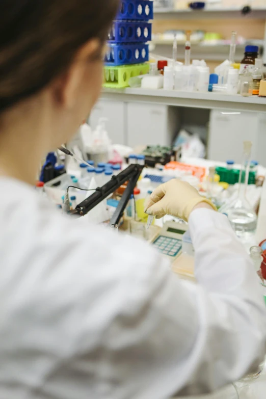 a close up of a person in a lab, pexels, plating, information, getty images, a wide shot