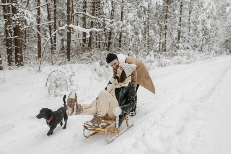 a man and a woman on a sled with a dog, by Emma Andijewska, pexels contest winner, renaissance, gif, pregnancy, white, romantic lead