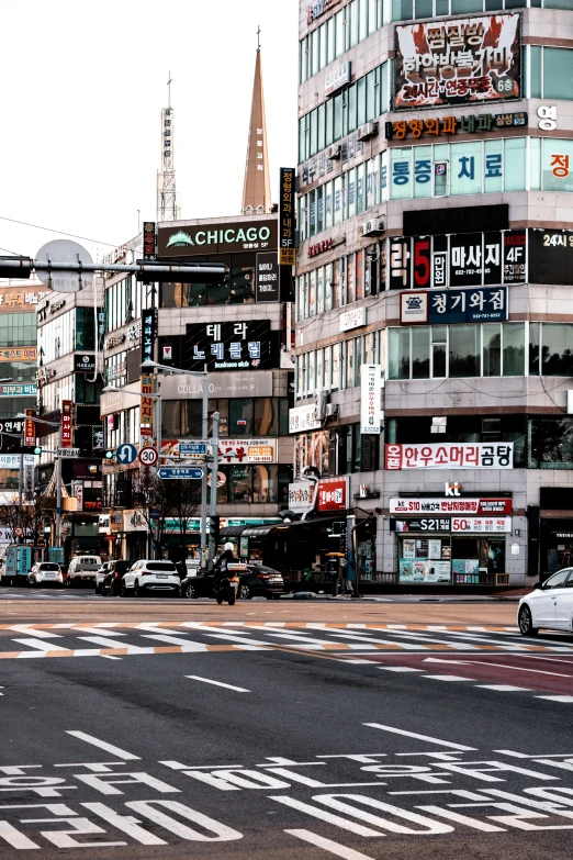 a city street filled with lots of tall buildings, by Jang Seung-eop, trending on unsplash, square, lots of signs and shops, traditional korean city, brown