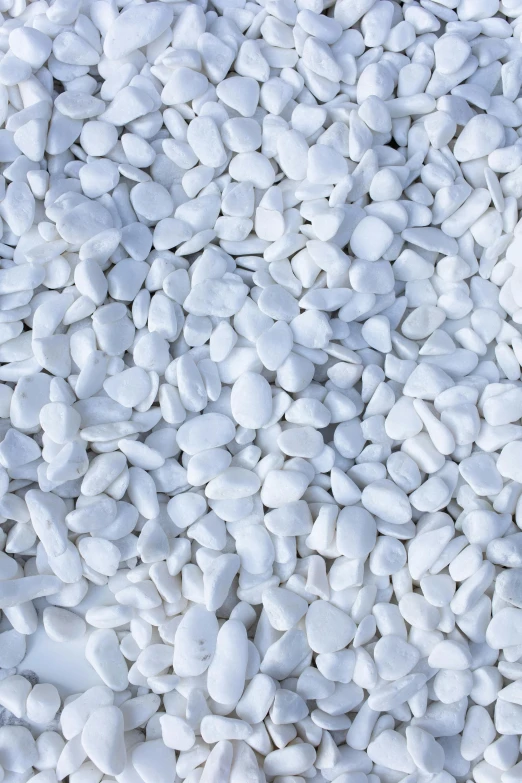 a close up of a pile of white pebbles, inspired by Coppo di Marcovaldo, plasticien, detailed product image, white sleeves, made of marble, white cyan