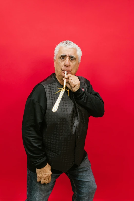 a man standing in front of a red wall brushing his teeth, an album cover, ric flair, with cigar, reza afshar, neal adams | portrait