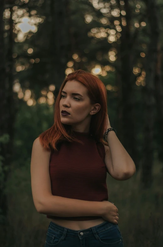 a woman standing in the middle of a forest, inspired by Elsa Bleda, pexels contest winner, renaissance, red hair and attractive features, concert, slightly minimal, pouting