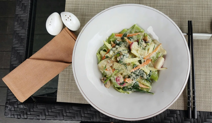 a close up of a bowl of food on a table, square, pastelwave, lettuce, item