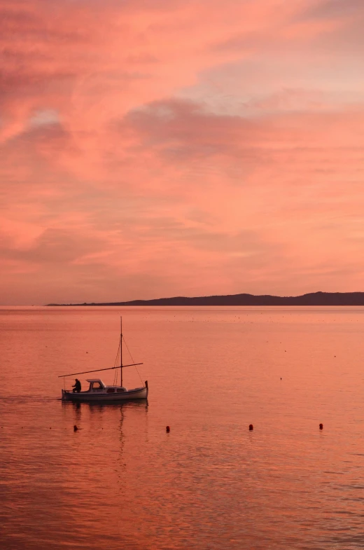 a boat floating on top of a large body of water, pexels contest winner, romanticism, orange / pink sky, holywood scene, fisherman, deep colour\'s