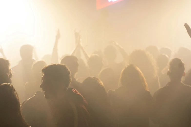 a crowd of people at a concert with their hands in the air, by Tobias Stimmer, happening, very smoky paris bar, volume fog, closed limbo room, jesus wasted at a party