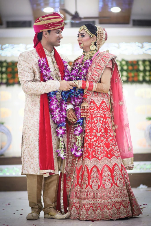 a man and woman standing next to each other, samikshavad, bride and groom, profile image, thumbnail, colourful clothing