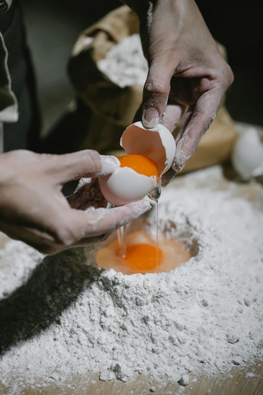 a person pouring an egg into a bowl, trending on unsplash, process art, bakery, ignant, abstract claymation, male and female