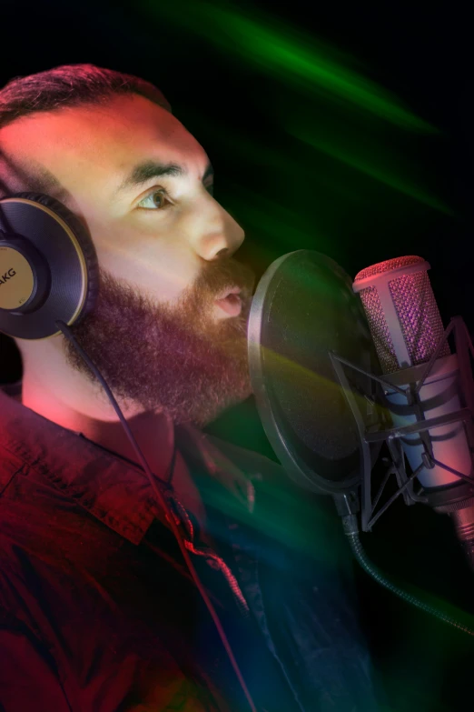 a man with headphones is singing into a microphone, photorealism, asmongold, vivid studio light, profile picture 1024px, coloured photo