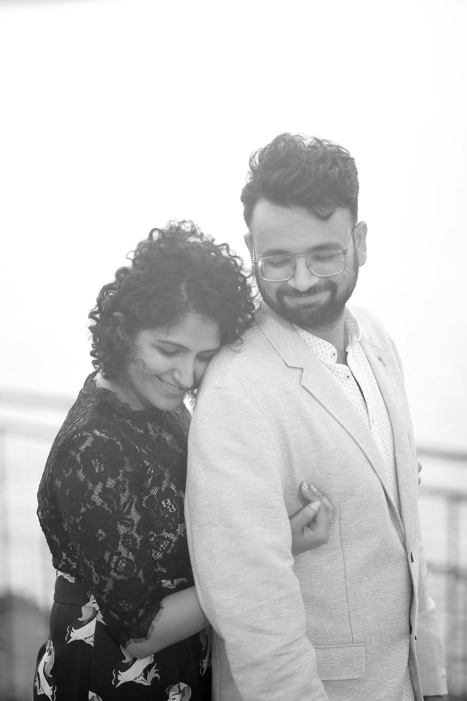 a man and woman standing next to each other, a black and white photo, by Max Dauthendey, curly and short top hair, vastayan, square, uploaded