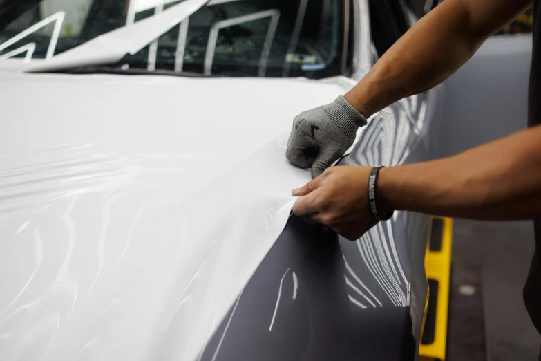 a person polishing the hood of a car, unsplash, hyperrealism, ilustration, smooth contours, cracked plastic wrap, “hyper realistic