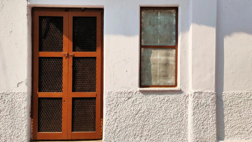 a red fire hydrant sitting in front of a white building, inspired by Pieter de Hooch, pexels contest winner, minimalism, french door window, screens, light - brown wall, intricate copper details