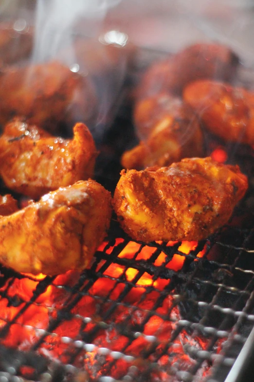 a close up of food cooking on a grill, ruffled wings, paisley, 6 pack, striking colour