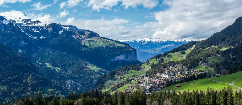 a scenic view of a village in the mountains, by Daniel Seghers, pexels, renaissance, lauterbrunnen valley, zoomed out to show entire image, panorama distant view, slide show