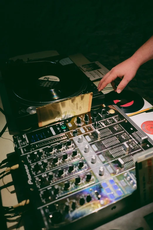 a close up of a person using a dj controller, an album cover, taken with kodak portra, event, high quality image, instagram story