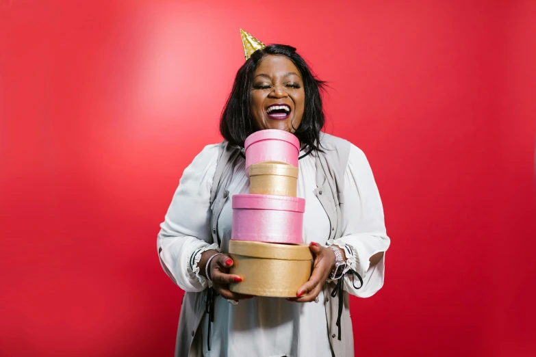 a woman with a crown on her head holding a stack of boxes, pexels contest winner, happening, plus size woman, happy birthday, essence, pink