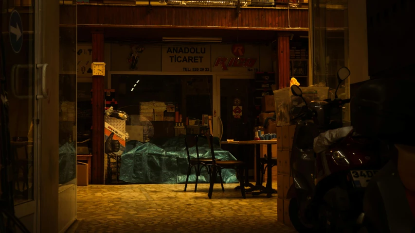 a couple of motorcycles parked in front of a building, by Elsa Bleda, hyperrealism, night time photograph, turkey, marketplace, asleep