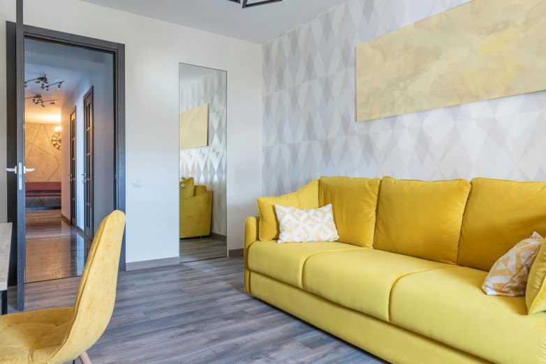 a living room with a yellow couch and a yellow chair, by Adam Marczyński, pexels contest winner, hyperrealism, doctors office, apartment design, zenith view, clean 4 k