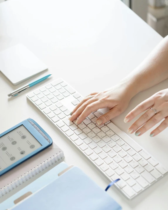 a close up of a person typing on a keyboard, trending on pexels, diary on her hand, white and pale blue, lgbtq, scientific paper