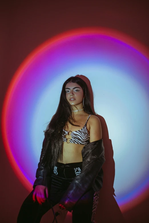 a woman standing in front of a colorful light, an album cover, trending on pexels, holography, madison beer girl portrait, shot in the photo studio, circle, wearing a crop top