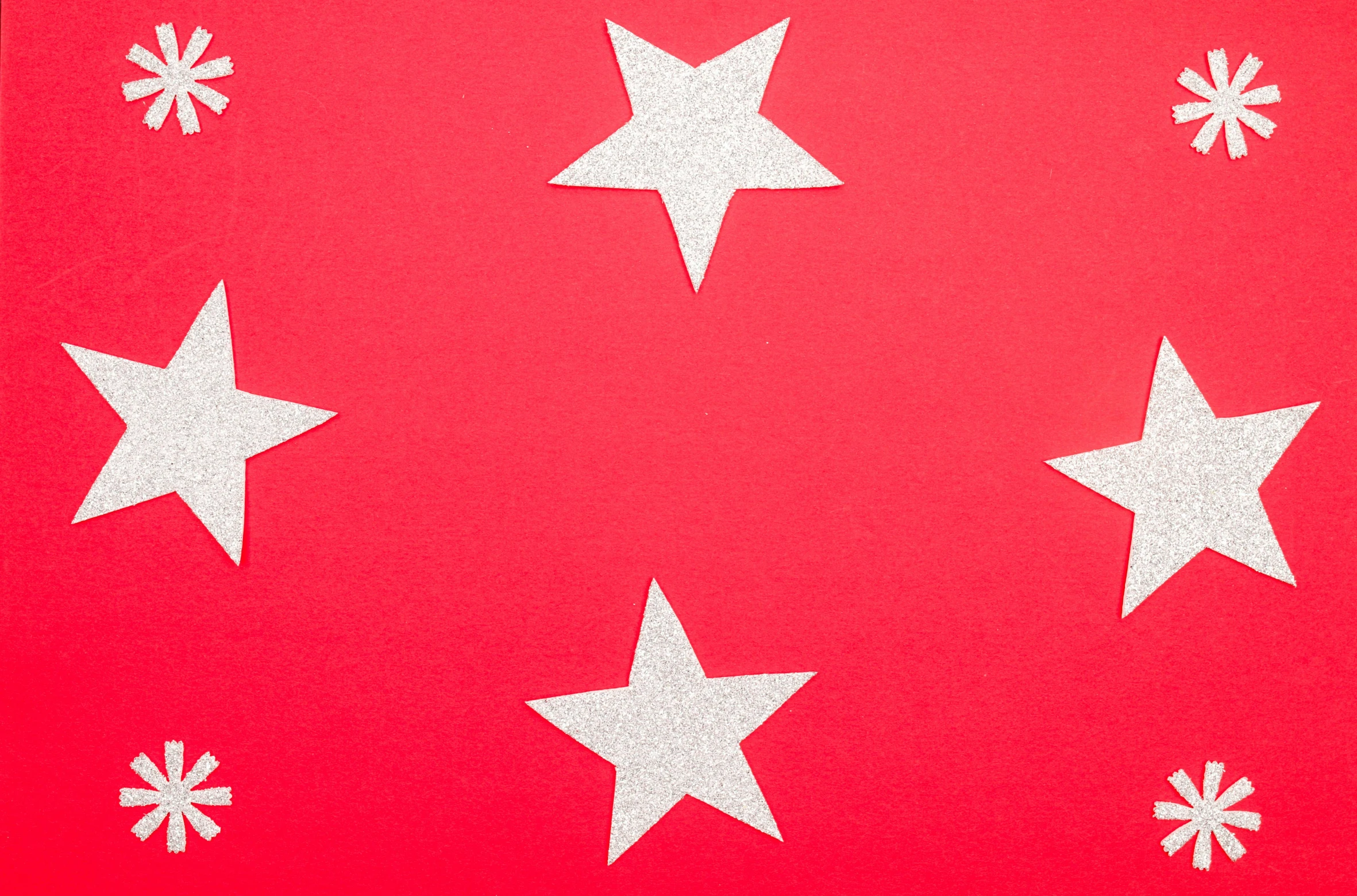 a red background with white stars and snowflakes, trending on pexels, pop art, bottom body close up, silver red, diecut, star hatcheries