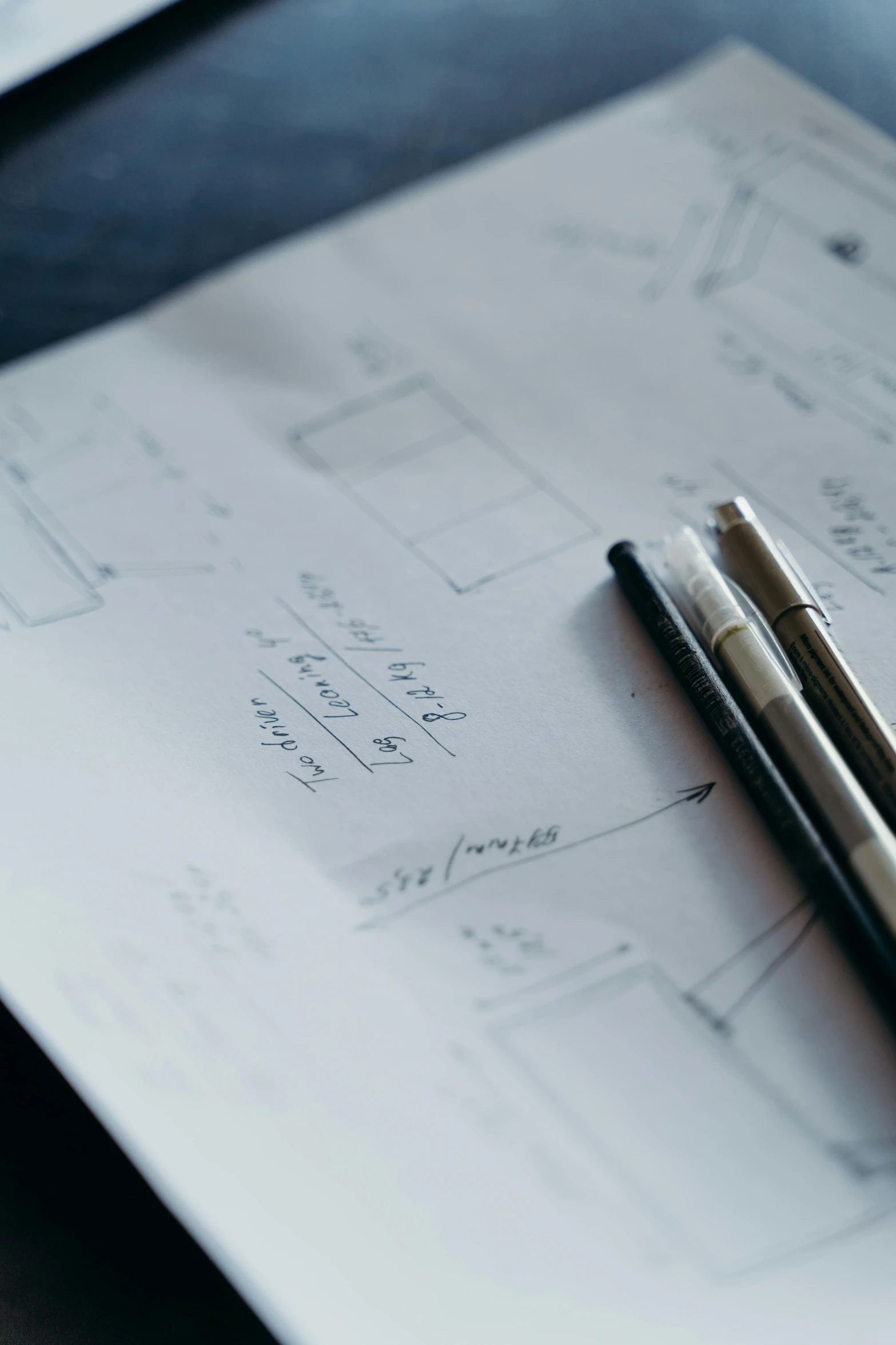 a pen sitting on top of a piece of paper, a drawing, engineering diagram, centered design, promo image, mid shot