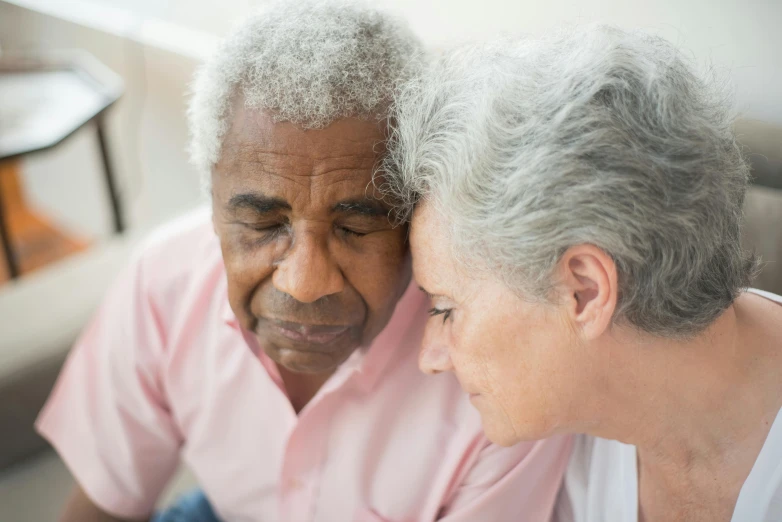 a man and a woman looking at a cell phone, pexels contest winner, hurufiyya, dementia, head bowed slightly, gray haired, profile image