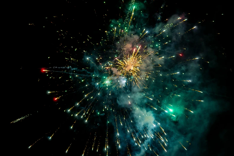 a fireworks is lit up in the night sky, pexels, hurufiyya, teal silver red, particle sim, high quality product image”, zoomed in shots