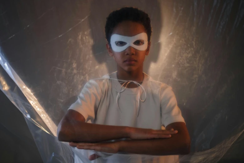 a man in a white shirt and a white mask, an album cover, inspired by Gordon Parks, pexels contest winner, afrofuturism, nerdy black girl super hero, unreal engine. film still, julian ope, light over boy