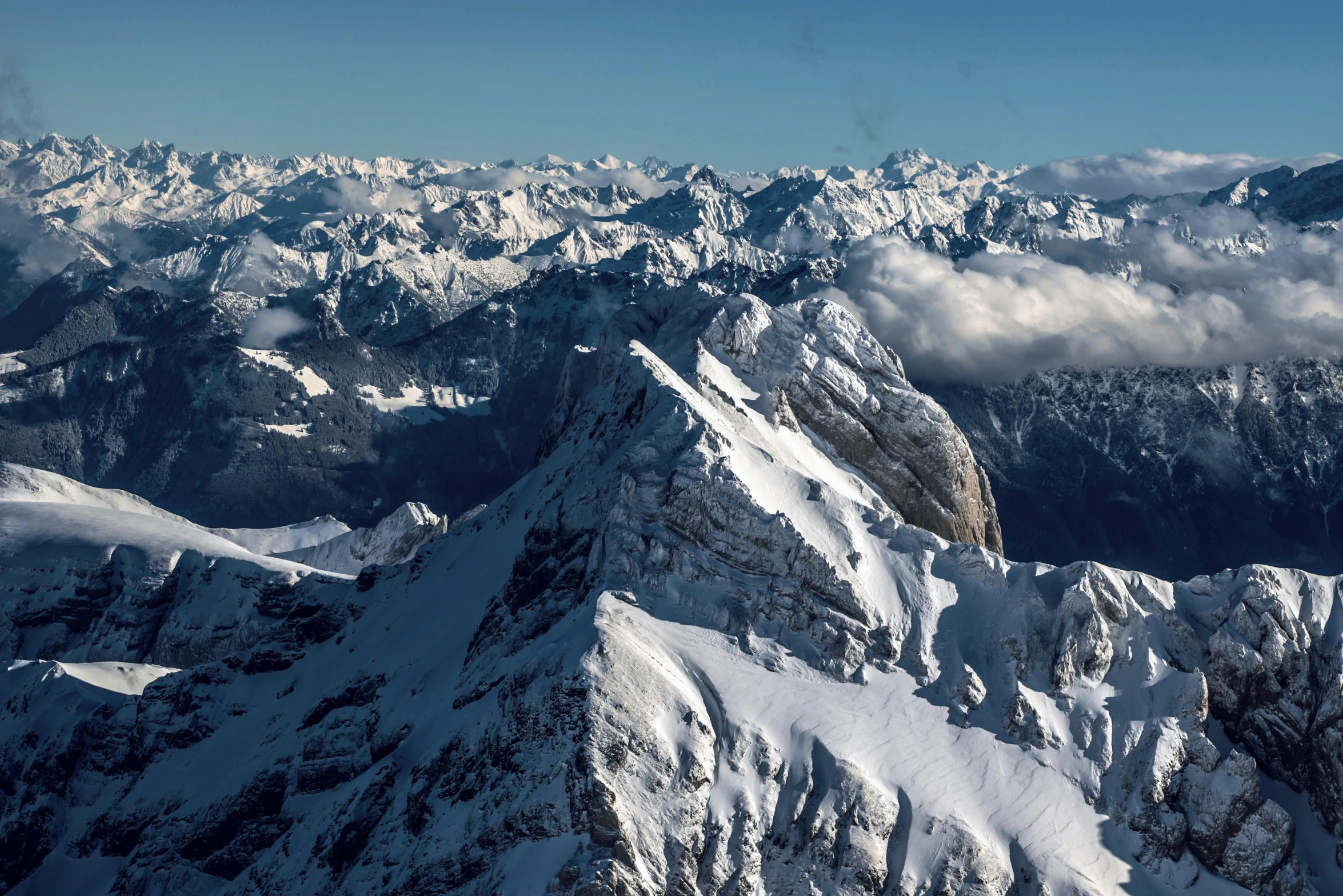 a group of mountains covered in snow and clouds, by Peter Churcher, pexels contest winner, hurufiyya, high resolution ultradetailed, aerial, high quality product image”, herzog de meuron