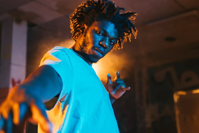 a man with dreadlocks standing in a room, pexels contest winner, black arts movement, hero pose colorful city lighting, angry and pointing, avatar image, brown skinned