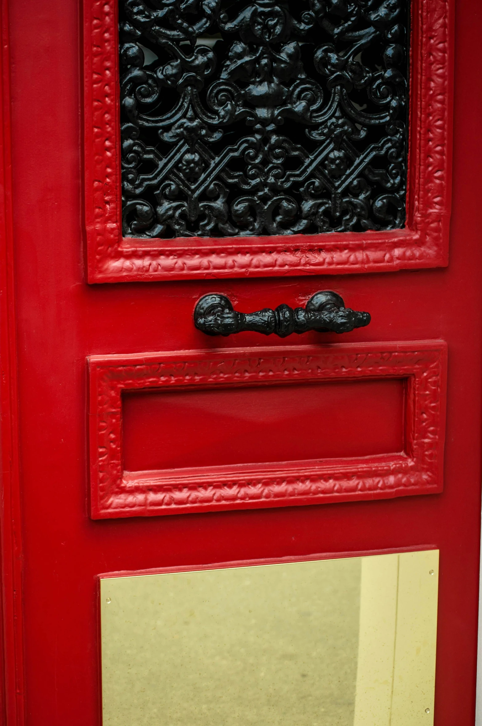 a close up of a red door on a building, payne's grey and venetian red, letterbox, ornate declotage, red - black