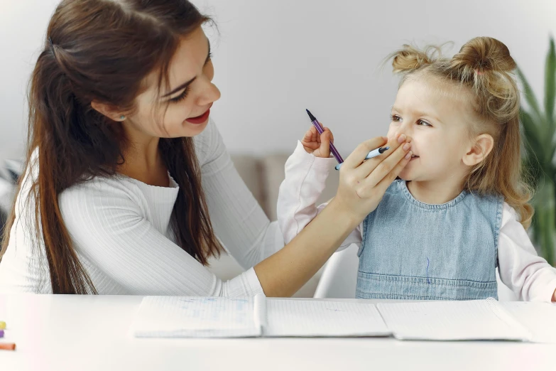 a little girl getting her makeup done by a woman, a child's drawing, pexels contest winner, academic art, manuka, having a snack, kid named finger, nursing