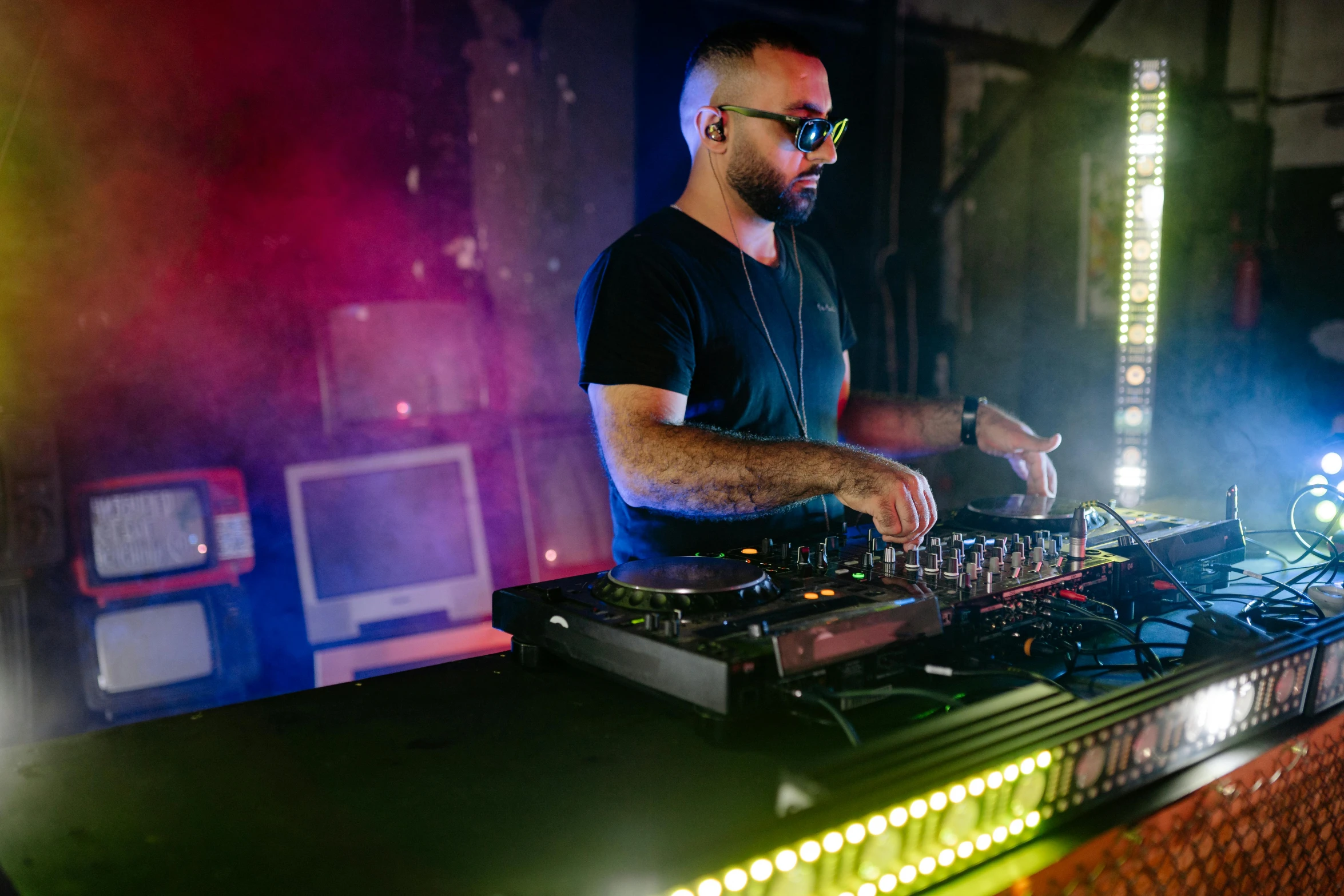 a man that is standing in front of a dj, pexels, avatar image, borja, serious lighting, industrial party