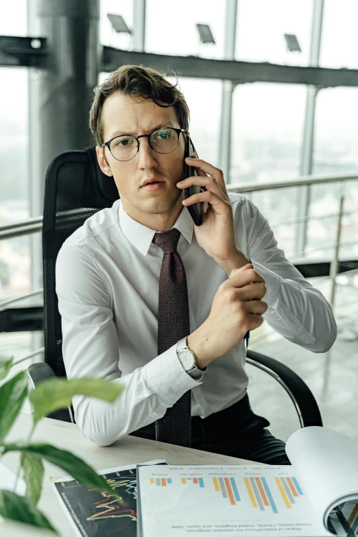 a man sitting at a desk talking on a cell phone, looking distracted, promo image, daniil kudriavtsev, multiple stories