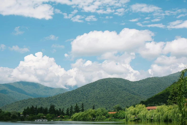 a body of water with mountains in the background, georgic, a park, conde nast traveler photo, fan favorite