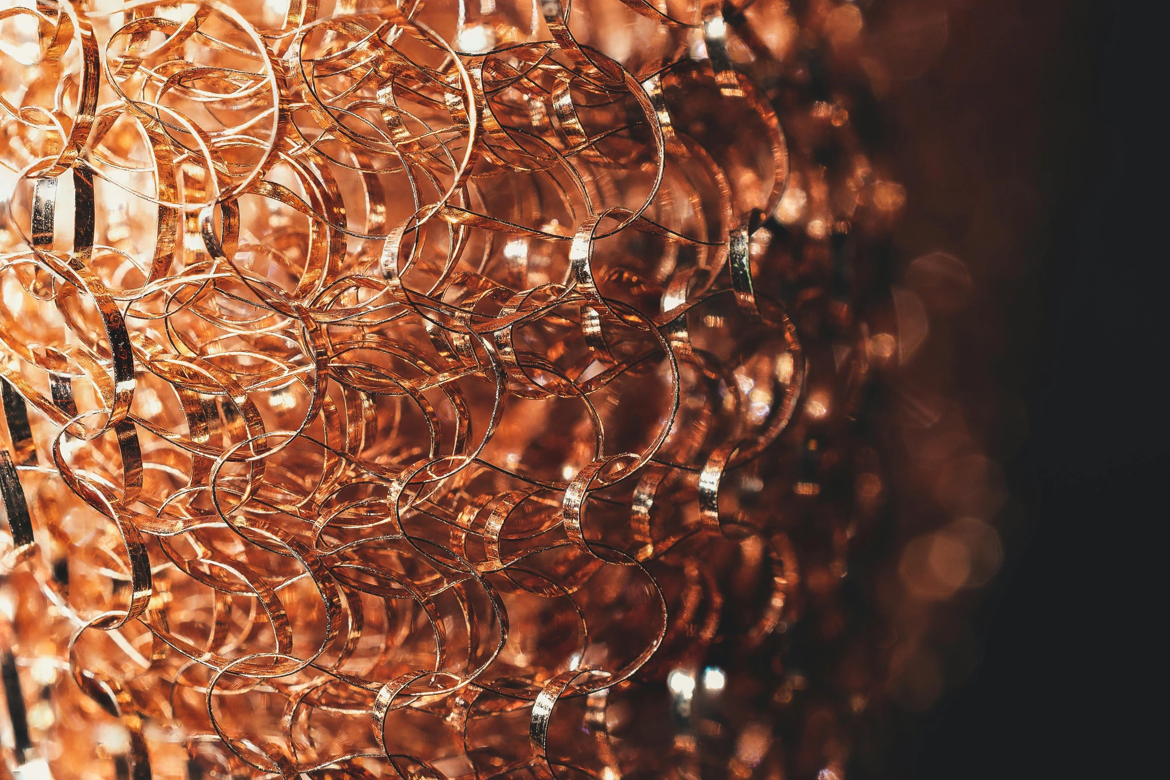 a close up of a piece of copper wire, inspired by Bruce Munro, pexels, chainmail, chandeliers, pur champagne damery, cinema 4d cinematic render