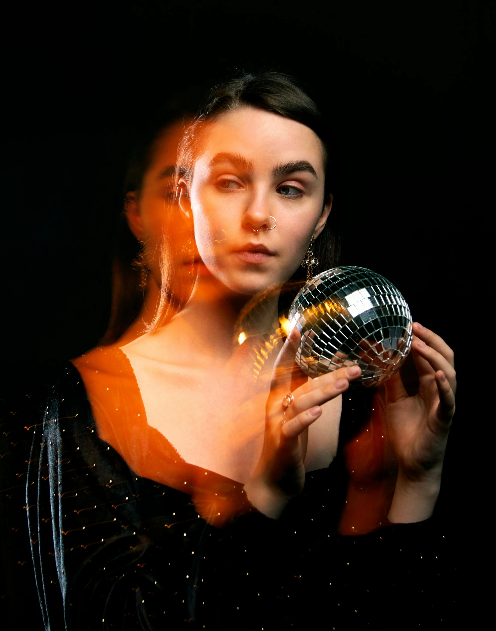 a woman holding a mirror ball in front of her face, an album cover, by Adam Marczyński, pexels contest winner, holography, portrait sophie mudd, 15081959 21121991 01012000 4k, glowing, portrait of florence pugh