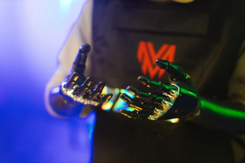 a close up of a person with a glove on, a hologram, by Adam Marczyński, mechanical limbs, the mekaverse, mechanised, mr. roboto